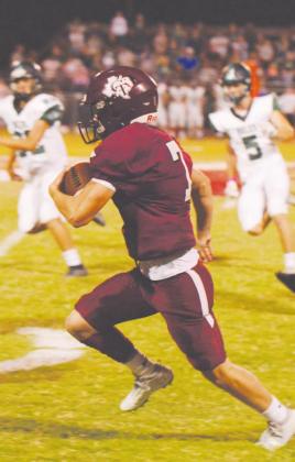 Cumby’s Justin Demidio runs with the ball in Cumby’s 40-26 loss to Boles on Homecoming. Demidio had an excellent game for the Trojans, finishing with a pair of touchdowns. Staff photo by Todd Kleiboer