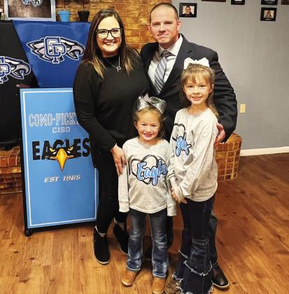 NEW COACH — Como-Pickton CISD has hired Jeremy Phillips as their new athletic director and head football coach. Phillips most recently served as the offensive coordinator at Hughes Springs High School. He is pictured with his wife Brittney, and daughters Peyton and Page. Submitted Photo