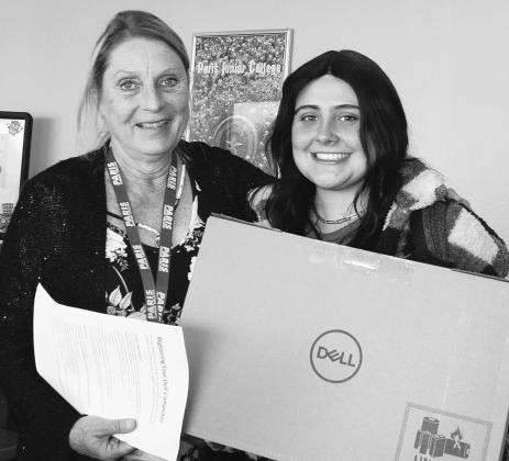 FREE LAP TOP — PJC-Sulphur Springs Center Office Manager Dana Smock, left, presents a free lap top computer to Maci Wright of Sulphur Springs for registering as a full-time, 12 semester credit hour student for the fall 2022 semester. The computer is to help those students taking a full load of classes to have the resources they need to succeed. Submitted photo