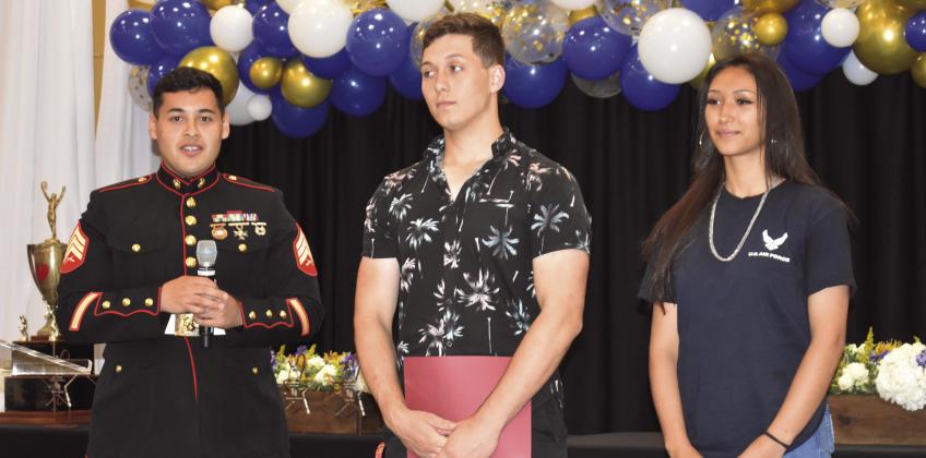 MILITARY SERVICE — Sgt. Jose Quinonezbaez of the United States Marines was present to recognize military service. From left, Quinonezbaez; Kobe Walker, U.S. Marines; Jazzmine Rodriguez, U.S. Army Force; not pictured — James Minyard, U.S. Marines and Cade Ray, U.S. Army.