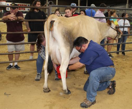 Leah Larsen and Mario Villarino, parents of pageant contestant Alexis Villarino, finished second among parents, with 40.1 ounces of milked from their designated cow.