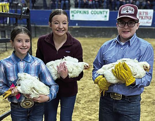 RIGHT PHOTO — Mylie McCormack (center) and her friends are happy after broiler competition. Staff photos by Enola Gay Mathews