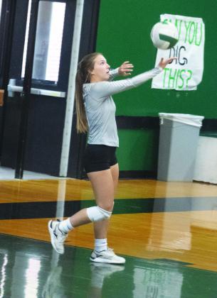SERVICE TIME — Maggie Brown (5) serves the ball during earlier road action. Brown recorded 17 digs, two assists, and one kill in the Lady Eagles' home sweep against Alba-Golden Friday. Photo by DJ Spencer