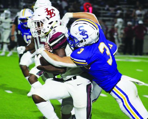 WRAPPING UP — Sulphur Springs' Austin Chaney (3) tackles the ball carrier during a game against Liberty-Eylau last season. The Sulphur Springs Wildcats were picked to finish in second place in their district by Dave Campbell's Texas Football. Photo by DJ Spencer