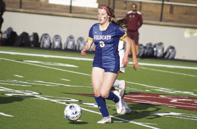 FAST PACE — Rowan Faircloth (3) moves the ball up the pitch during the Lady Wildcats' Area playoff game against Palestine this past season. Faircloth was named MVP of District 13-4A following a stellar season on the pitch. Photo by DJ Spencer