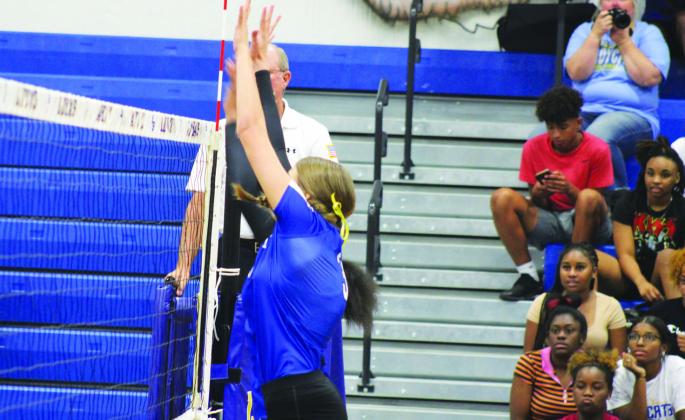 Rainey Johnson (3) goes up for a block during recent action. Johnson had a big game against Clarksville, recording 11 kills, four assists, three aces, and one block. Photo by DJ Spencer