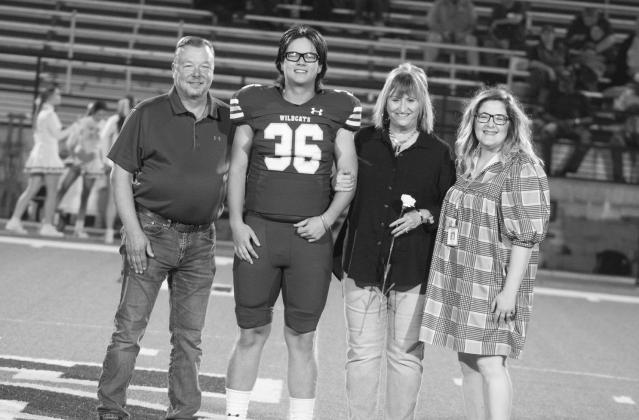 Kody Barclay (36) was escorted by his parents, Bryan and Lisa Barclay. Also pictured is Sulphur Springs High School Information and Media Integration Specialist Megan Tingle (first from right).