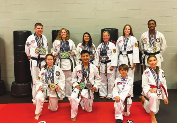 Multiple members of the Sulphur Springs American Taekwondo Assocation (ATA) claimed 37 medals at the Southern US District Championships. Picture are: Front row, left to right: Summer Miller, Abraham Shadix, Brandon Bilyeu, and EmmaLynn Bodiford. Back row, left to right: Daron Bilyeu, Harleigh Stegient, Sam Perry, Susie Chessher, Karisma Stegient, and Dequavian Person. Submitted Photo
