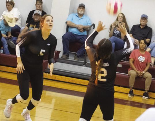 SETTING UP — Bella Romero (2) sets a pass for Addi Monk (5) during the Lady Eagles' game against Cumby Friday. Romero recorded a 29-assist, 19-dig double-double, adding eight aces and four kills, while Monk came up with 27 digs, nine kills, three assists, and one block in the Lady Eagles' five-set victory Friday. Photo by DJ Spencer