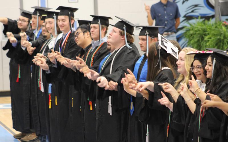 The Como-Pickton High School Senior Class of 2026 lines the Lenise Miller Boseman Competition Gymnasium to sing the school song as a group, one last time, during commencement exercises.
