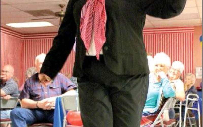 Patsy Crist as Cricket the Clown dances to “All My Ex’s Live in Texas.”