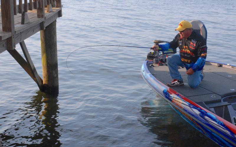 Crappie fishing expert Wally Marshall prepares to shoot a jig beneath a dock on Toledo Bend. Done correctly, Marshall says shooting will catapult the jig at a low angle, parallel to the water, with enough velocity that it will sail far beneath the dock. Courtesy/Matt Williams
