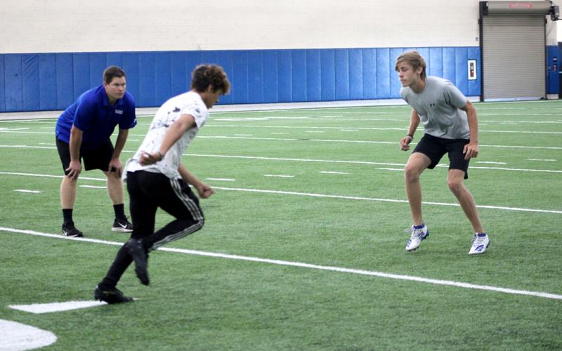 Student athletes run drills this week at The Edge summer conditioning program at Sulphur Springs High School.