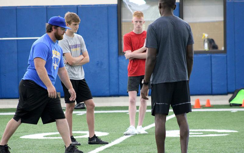 Student athletes run drills this week at The Edge summer conditioning program at Sulphur Springs High School.
