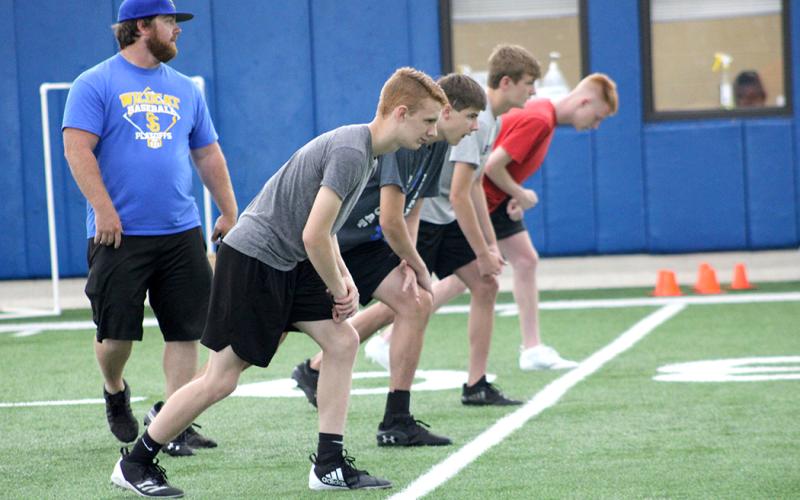 Student athletes run drills this week at The Edge summer conditioning program at Sulphur Springs High School.