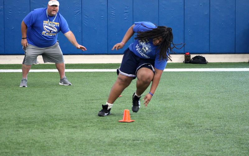 Student athletes run drills this week at The Edge summer conditioning program at Sulphur Springs High School.