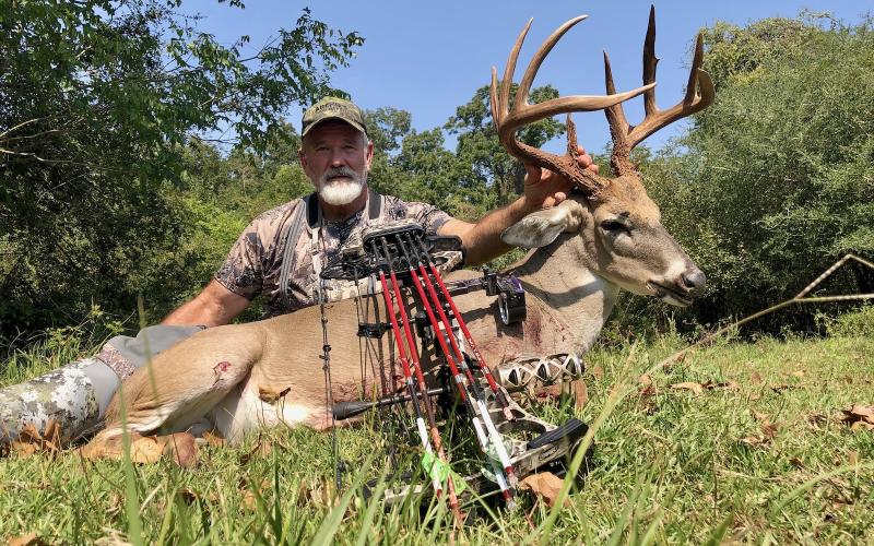 Splendora archer Chris Barrilleaux with a 6 1/2-year-old San Jacinto County 10-pointer bagged on the morning of Oct. 4. The buck led Barrilleaux on quite a chase that ultimately ended on the opposite of the Trinity River from where it began. Courtesy/Chris Barrilleaux via Matt Williams