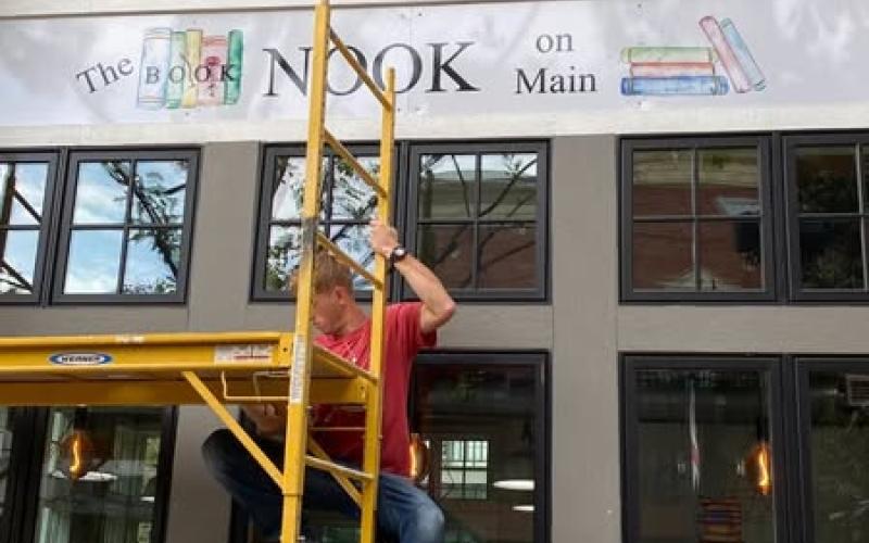 Specially designed art by local artist Raleigh Rhodes makes up the sign above the bookstore