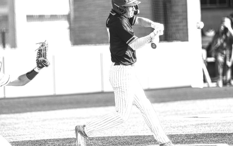 Ryan Karr (7) hits the ball during the Wildcats' game against Van at the Mount Vernon Tournament. The Sulphur Springs Wildcats opened their season with five games last week, posting a 2-2-1 record. Photo by Dinh Tran