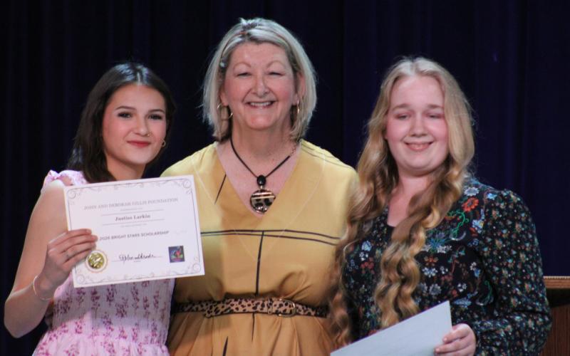 John and Deborah Gillis Foundation Executive Director (center) Robin Shrode announces Justiss Larkin and Esther Steele as recipeints of $40,000 Bright Star Scholarships. Staff ph0tos by Lexi Delarosa
