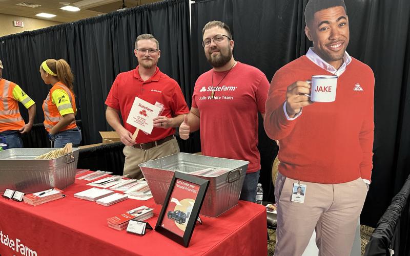 Scotty Hanks and Shaun Feners, account managers with 'Jake' at Julia Wilhite State Farm Insurance.