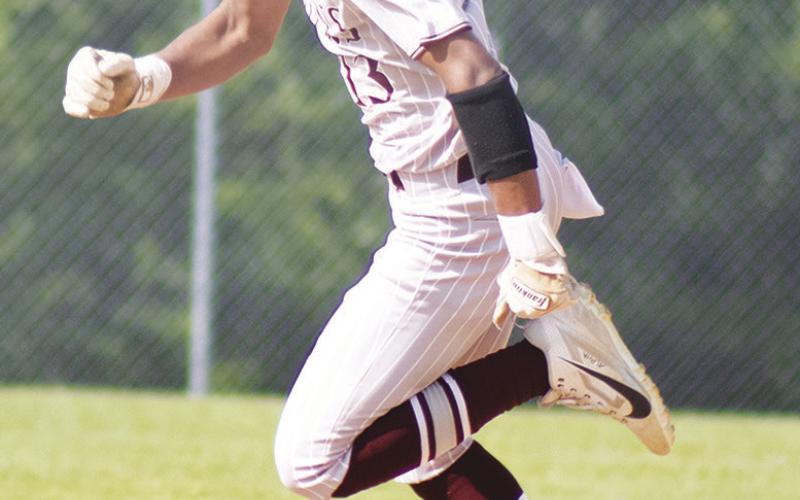 Cumby's Gunner Campbell (13) races towards third base during a game against Yantis this past season. Campbell earned Second-Team All-District honors as an outfielder following a strong junior season.