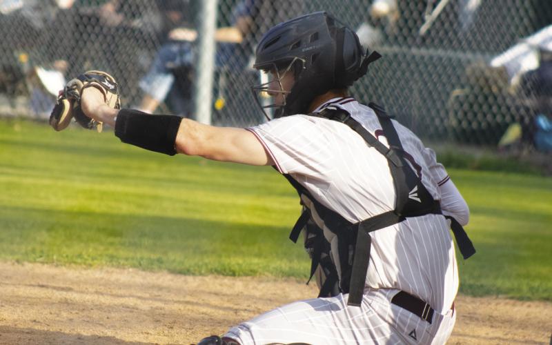 Cumby's Channing Herman (3) catches a pitch during a game against Rivercrest this past season. Herman earned Second-Team All-District honors for his play behind the plate during his junior season. Staff Photos by DJ Spencer