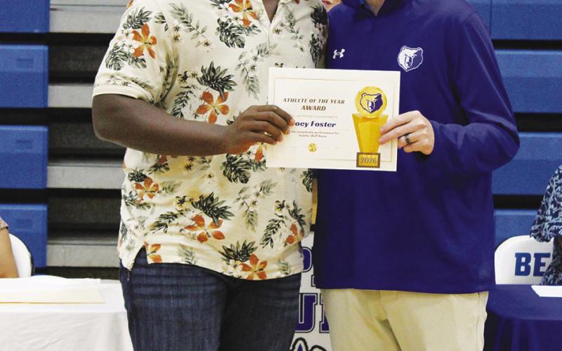 JT Foster (left) was named Male Athlete of the Year at Sulphur Bluff's Athletic Banquet Tuesday. Coach Casey Riddle presented the award. Foster also earned the Boys Basketball MVP award.