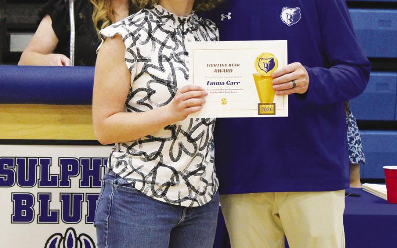 Emma Carr (left) was a co-recipient of the Girls Fighting Bear Award, given to the hardest-working female athlete. Coach Casey Riddle presented the award. Carr also earned MVP honors for girls golf and softball.
