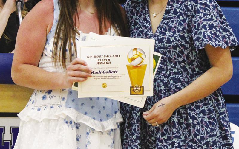 Madi Collett (left) was a co-recipient of the Volleyball MVP Award at Sulphur Bluff's Athletic Banquet Tuesday, sharing the award with Zaylee Peyton. Presenting the award is Coach Layna Hall.