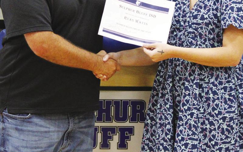 Ryan Watts (left) received the Ron Braneff Fan of the Year Award at Sulphur Bluff's Athletic Banquet Tuesday. Coach Layna Hall presented the award.
