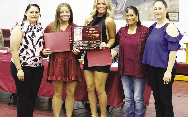 Kinslee Dowdle (second from left) and Ella Horne (middle) each received the Arsenio Ugalde Memorial Scholarship, worth $1,000. They are pictured with (from left) Mary Ugalde, Dula Ugalde and Juliana Osornio. See Page 2 for more photos. Staff photo by DJ Spencer