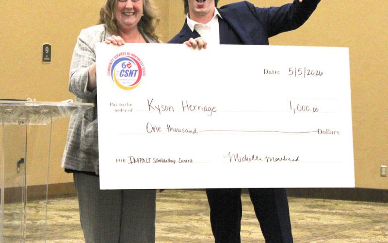 Michelle Morehead presented the $1,000 Community Services of Northeast Texas Inc. Impact Scholarship to Kyson Herriage.