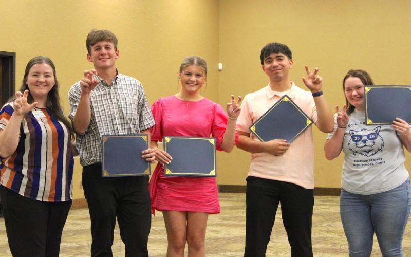 Ashton Baum presents $8,000 University of Texas at Tyler scholarships to Corbin Argenbright, Amerson Boles, Rafael Flores and Mallory Peel.