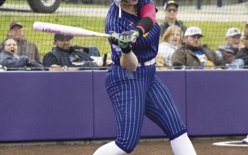 Claire Thompson (23) takes a big swing at a pitch during the Lady Wildcats' Area Playoff series against Athens this past season. Thompson was named District 14-4A Utility Player of the Year, following a strong junior season.