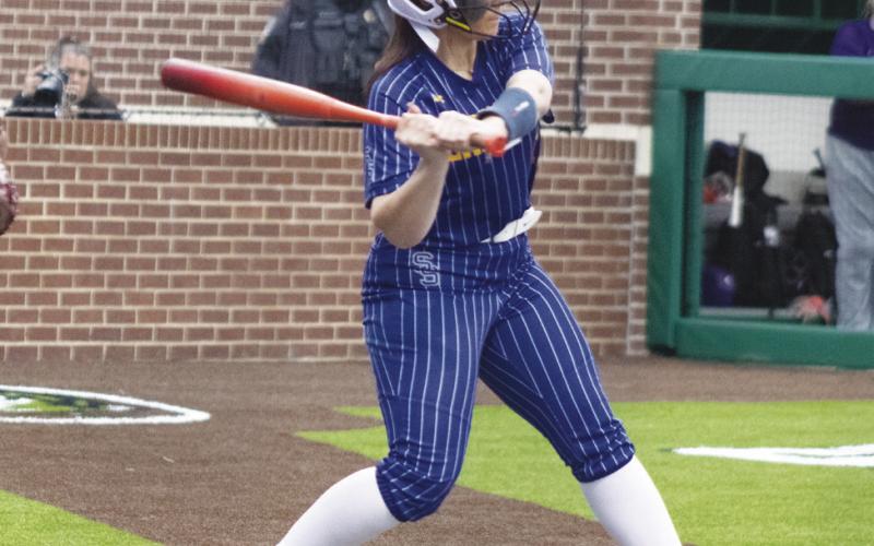 Gracie Thompson (11) swings at a pitch during the Lady Wildcats' Regional Semifinals series against Richland this past season. Thompson earned First-Team All-District honors for her play in the infield during her senior season.