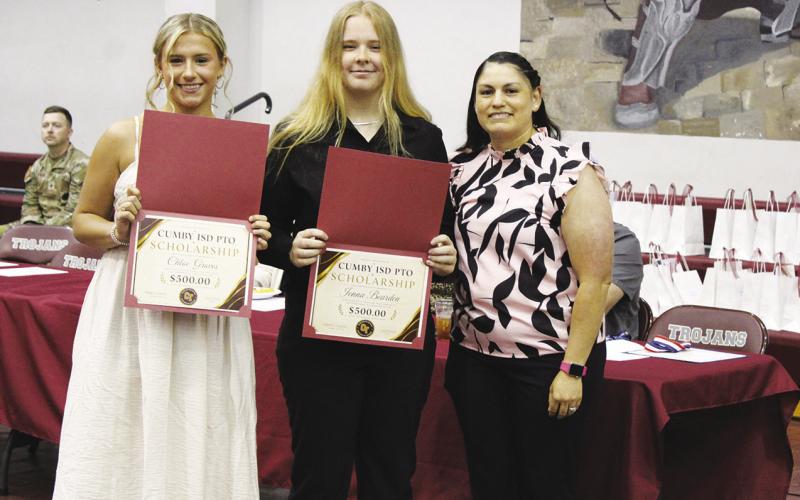 Chloe Groves (left) and Jenna Bearden (middle) received the Cumby Collegiate ISD PTO Scholarship, worth $500. Mary Ugalde presented the scholarships.