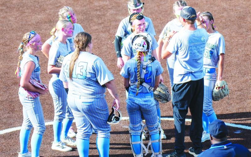 The Como-Pickton Lady Eagles listen to instructions from Head Coach Trevor Wallace during a circle visit in Game 1 of their Class 2A/D2 State Semifinals series against Shiner. The Lady Eagles split the first two games of the series, losing the first game 13-1 and winning the second game 4-2. Photos by Colton Foster, Sports Editor at The Huntsville Item