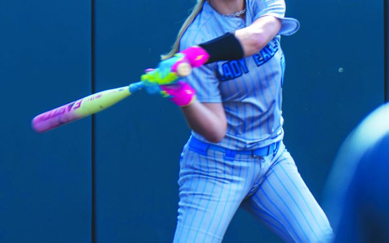 Saylor Smith (6) swings at a pitch during Game 1 of the Lady Eagles' Class 2A/D2 State Semifinals series against Shiner Wednesday. This swing resulted in a solo home run, which turned out to be the Lady Eagles' only run in their 13-1 loss.