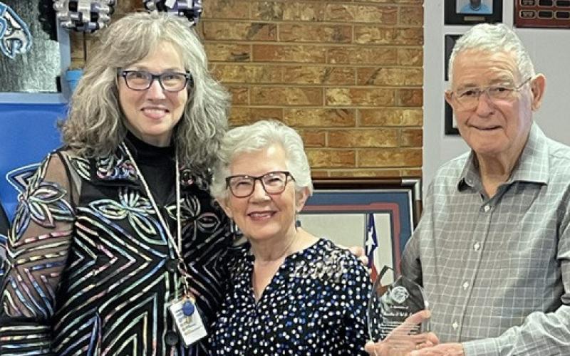 CPCISD Superintendent Lydia Walden presents Martha and W.B. Cox the Volunteer of the Year award at the May school board meeting. Courtesy photo