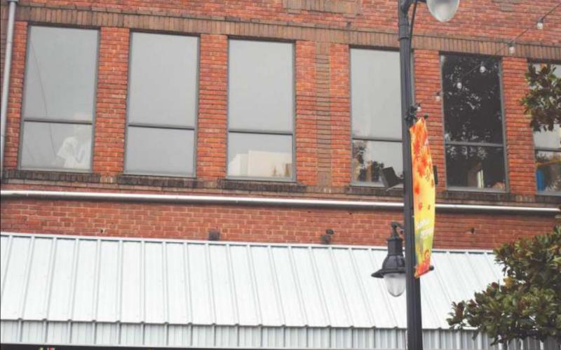 Muddy Jake’s Bar and Grill hosts live music and sports on its ground floor, and there are tales of bumps in its attic, especially late into the day. Staff photo by Todd Kleiboer