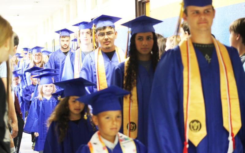 The Saltillo Independent School District Class of 2026 seniors walk with the graduating kindergarten class through the halls of the school on Monday, May 11. Staff phto by Lexi DelaRosa