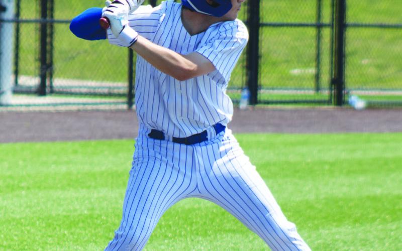 Senior Lane Fouse (12) begins his swing during Game 3 of the Wildcats' Area playoff series against Lindale Saturday. In what turned out to be his final high school baseball game, Fouse batted 1/2, recorded two RBIs and scored a run in the Wildcats' 5-3 loss.