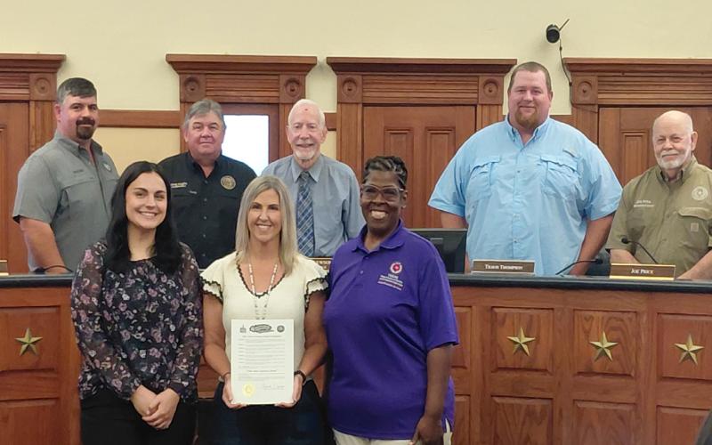 Hopkins County Commissioners Court presents a signed proclamation declaring June as Elder Abuse Awarness Month. Photo by Lexi Delarosa