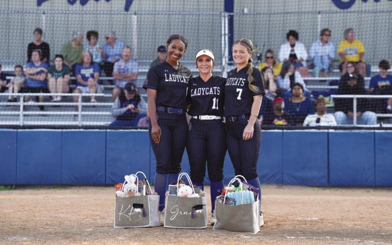 The Sulphur Springs Lady Wildcats celebrated Senior Night for their three seniors, (from left) KK Montgomery, Gracie Thompson and Bayler Boatman, prior to their game against North Lamar Tuesday. Each senior was presented with a gift basket. Photo by DinhTran