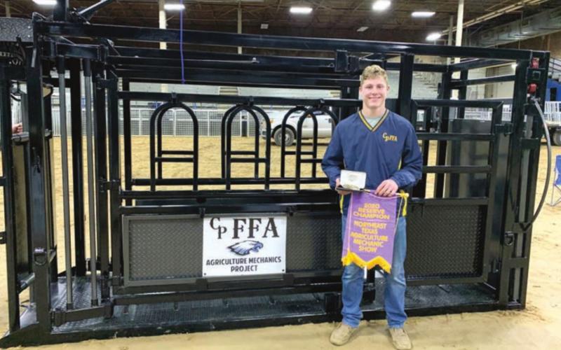 The cattle squeeze chute built by Jackson Monk (pictured), Canyon Thomas and Braden Miller received Reserve Champion at the NETLA Ag Mech Show Tuesday night at the Hopkins County Regional Civic Center. Courtesy/Como-Pickton FFA