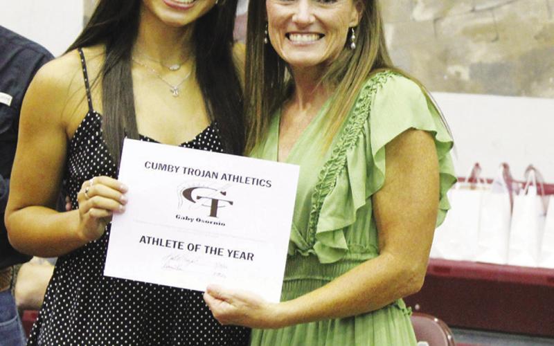 Gaby Osornio (left) was named Female Athlete of the Year at the Cumby Collegiate Athletic Banquet Tuesday. Coach Katie Emeyabbi presented the award. Osornio also earned the Spirit MVP Award in cheerleading, Girls Basketball MVP Award and Runner MVP in track and field.