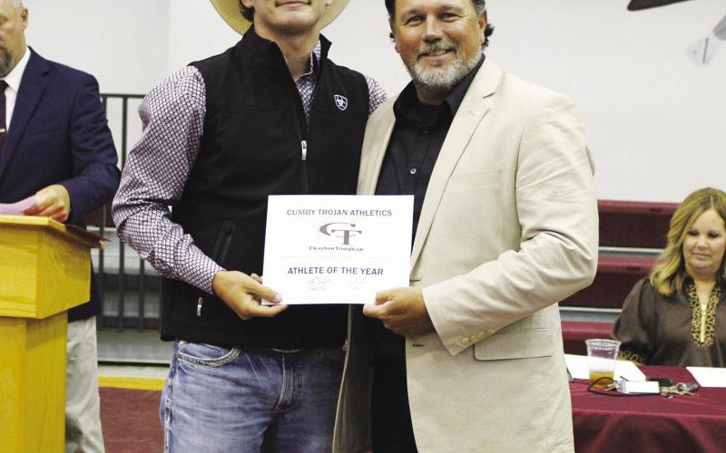 Chayton Vaughan earned the Male Athlete of the Year Award at the Cumby Collegiate Athletic Banquet Tuesday. Coach Aaron Emeyabbi presented the award. Vaughan also earned the Boys Basketball MVP Award, Football Offensive MVP Award and Boys Track and Field Runner MVP.