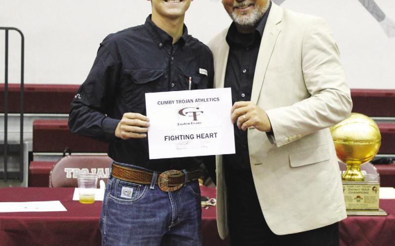 Jayden Evans (left) was also a co-recipient of the Male Fighting Heart Award at the Cumby Collegiate Athletic Banquet Tuesday. Coach Aaron Emeyabbi presented the award. Evans also received the Baseball Defensive MVP Award.