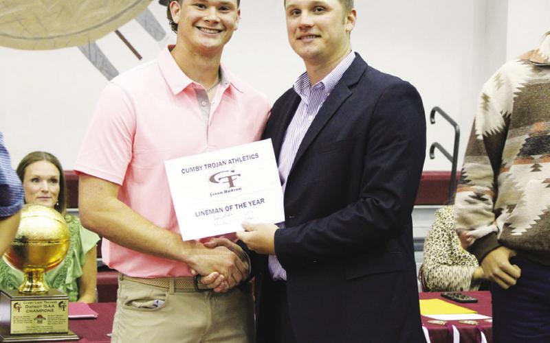 Jaxon Hudson (left) was named Lineman of the Year for football at the Cumby Collegiate Athletic Banquet Tuesday. Coach Mitchell Green presented the award.